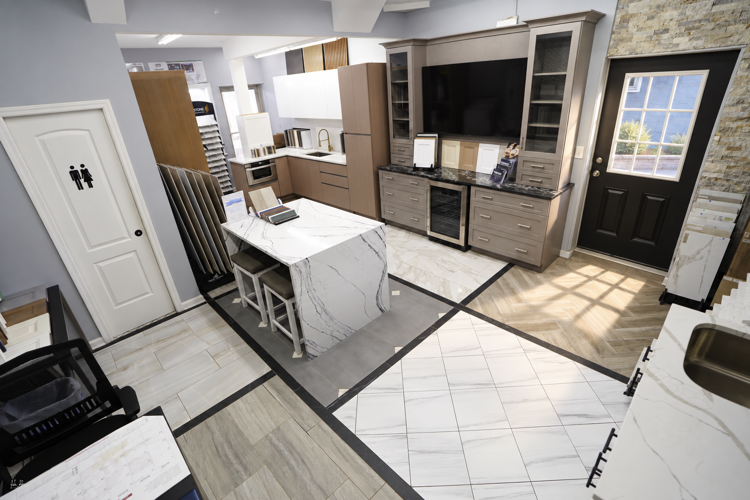 Kitchen design studio with island and cabinet displays at Class Remodeling in Levittown, NY